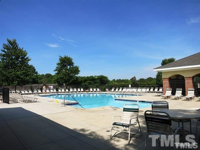 4713 Longhill Lane Raleigh, NC 27612 - Photo 18 of 18 a view of a swimming pool and lounge chairs