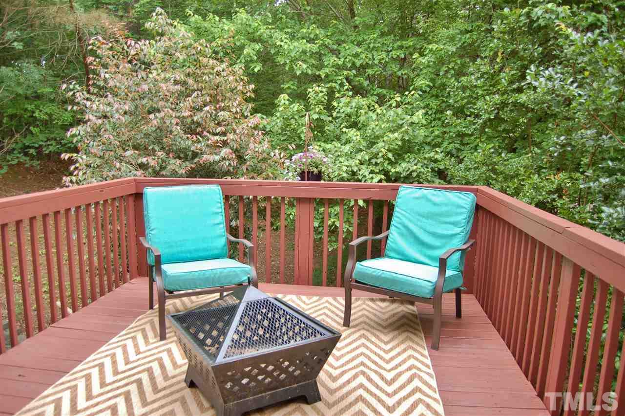 4713 Longhill Lane Raleigh, NC 27612 - Photo 8 of 18 a view of chairs and a table in the balcony