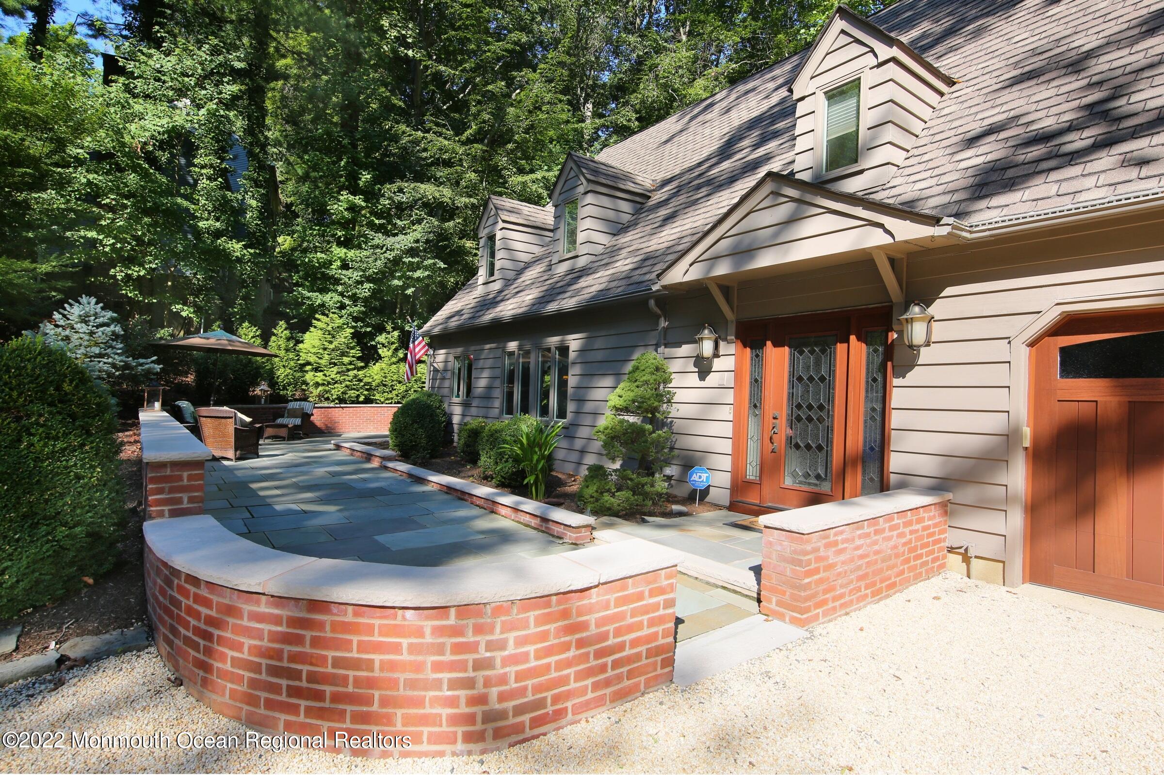 161 Pelican Road Middletown, NJ 07748 - Photo 38 of 43 Wrap Around Brick Retaining Wall