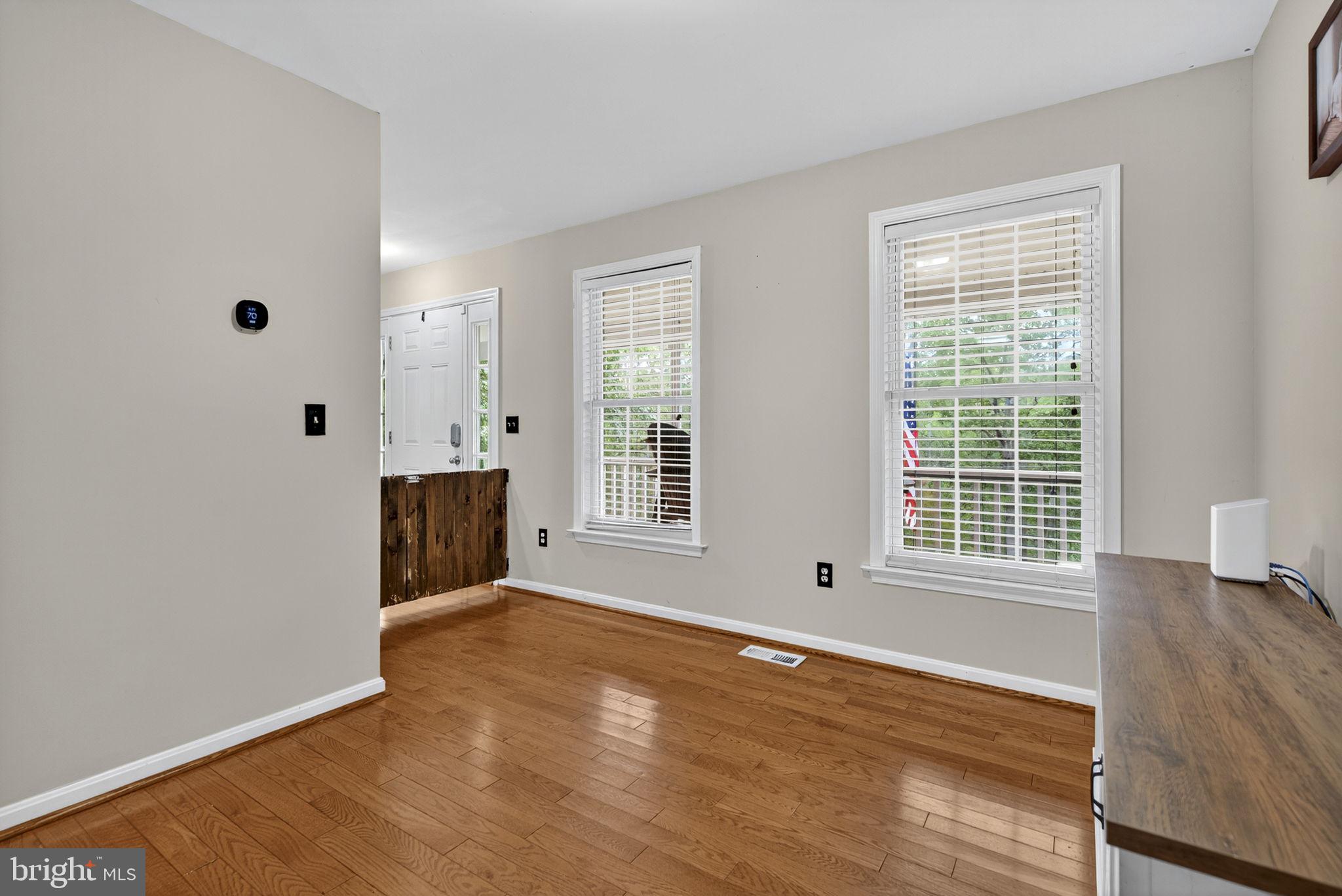 10277 River Road Rixeyville, VA 22737 - Photo 15 of 32 a view of an empty room with wooden floor and a window