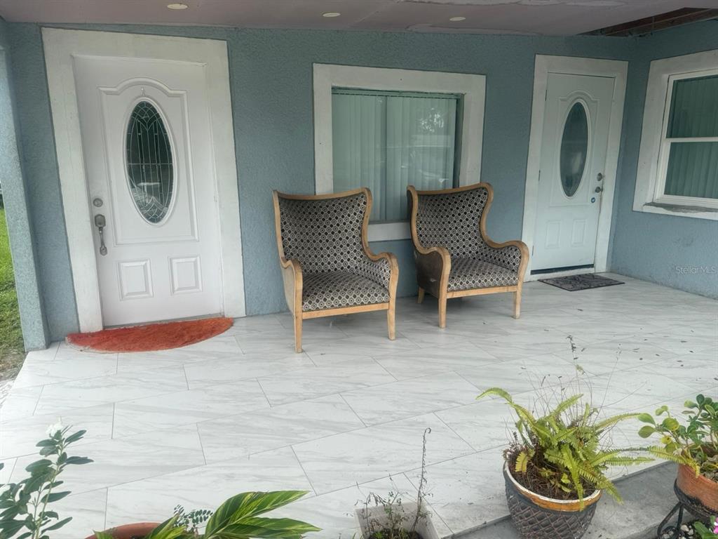 1509 Neil Street Plant City, FL 33563 - Photo 3 of 14 a room with furniture and a potted plant