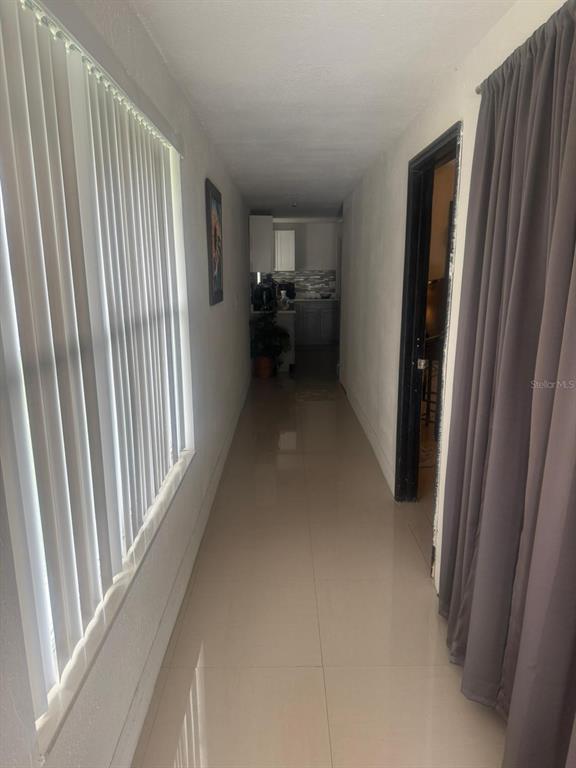 1509 Neil Street Plant City, FL 33563 - Photo 8 of 14 a view of hallway with furniture and front door