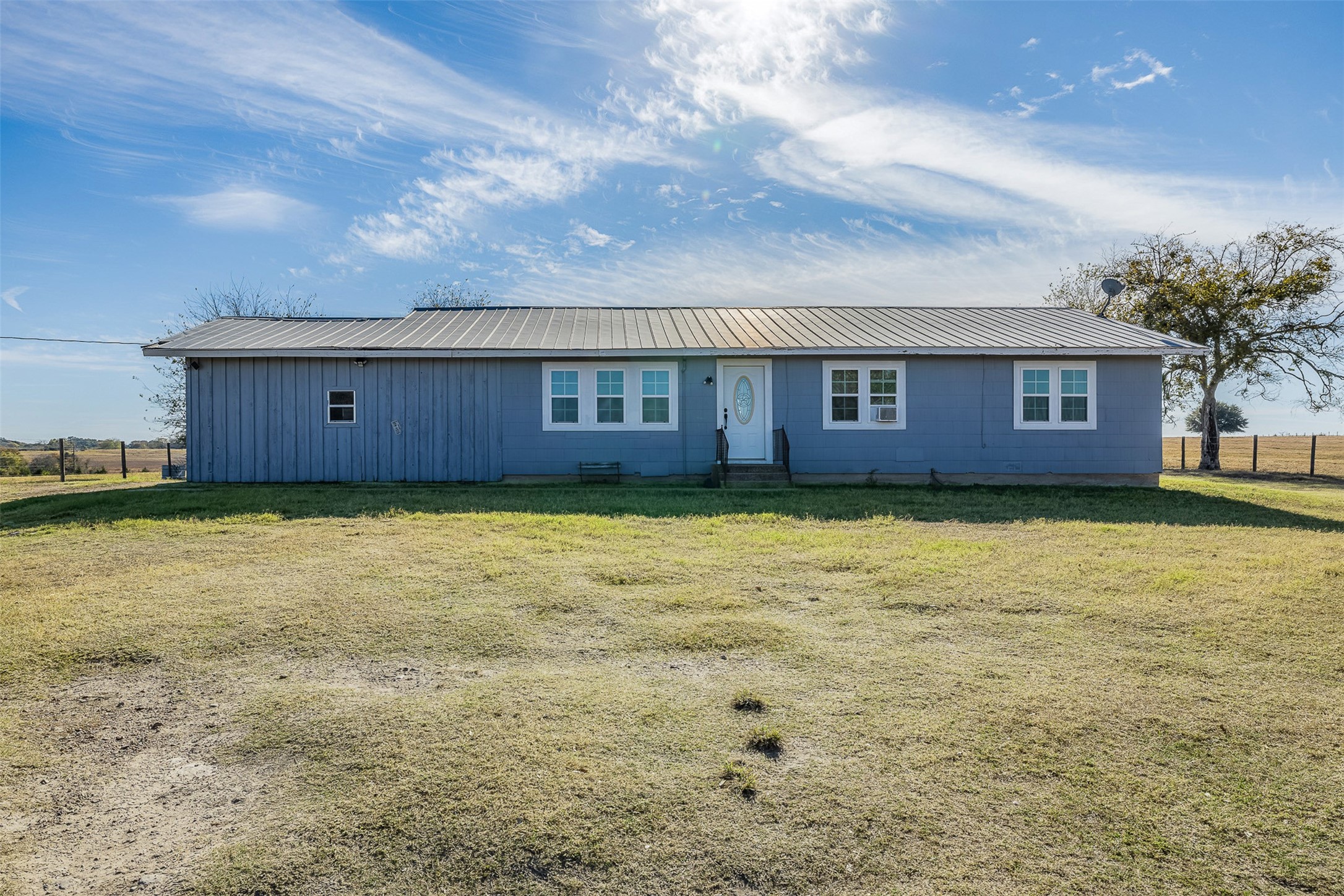 4435 Hartfield Road Round Top, TX 78954 - Photo 11 of 20 a view of a house with a yard