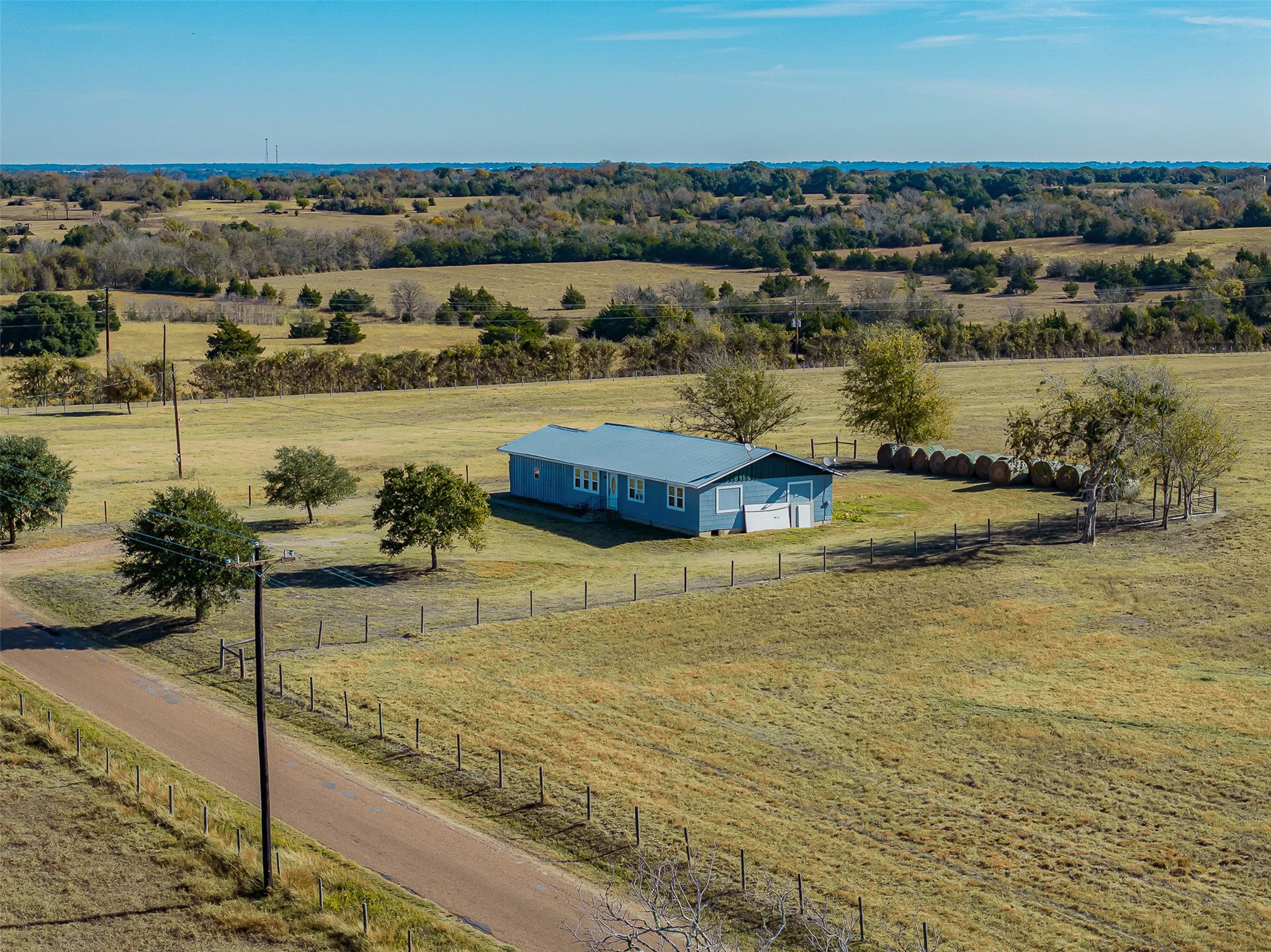 4435 Hartfield Road Round Top, TX 78954 - Photo 13 of 20 a view of a lake with a mountain