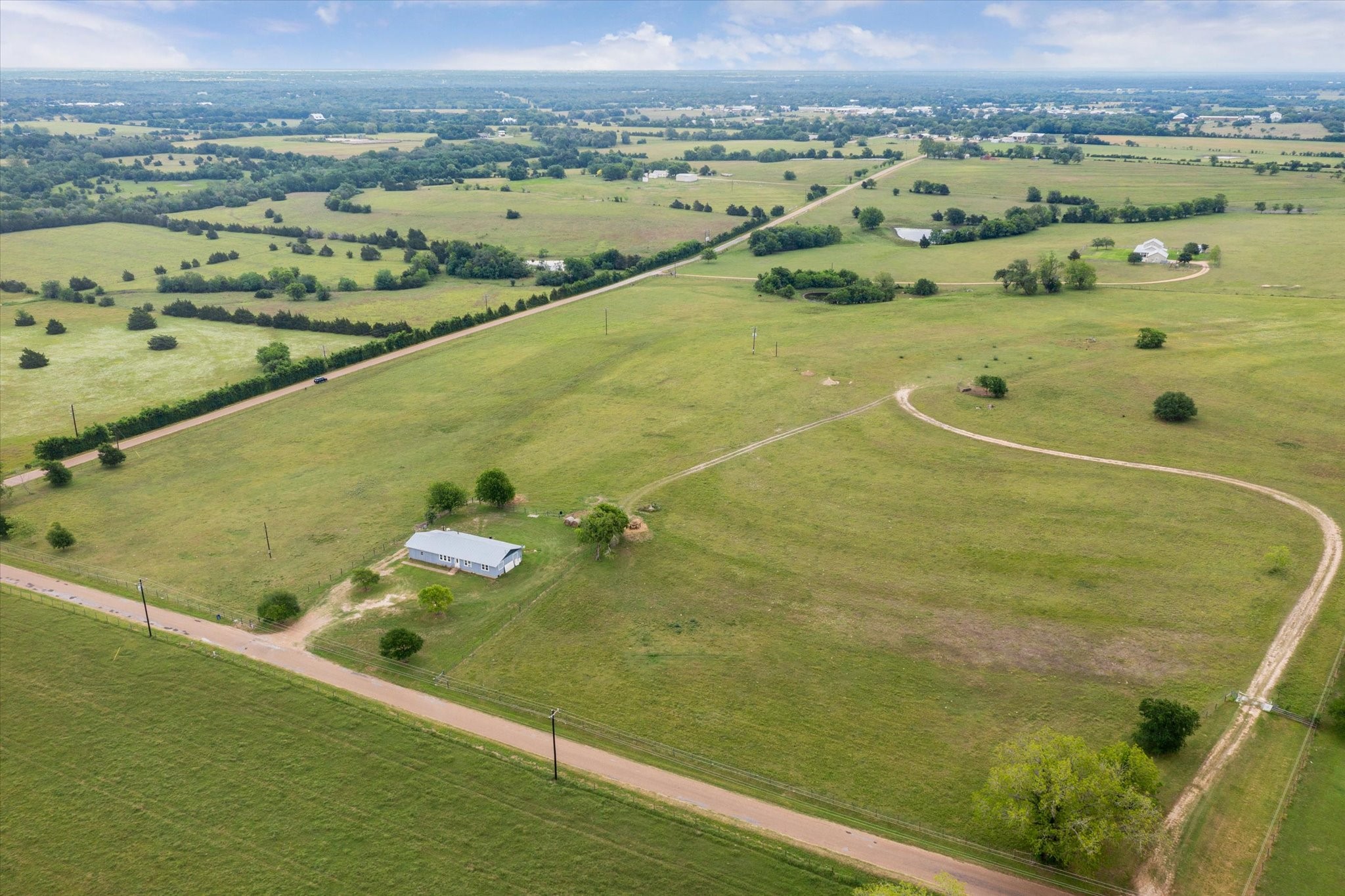 4435 Hartfield Road Round Top, TX 78954 - Photo 14 of 20 an aerial view of a residential houses with outdoor space