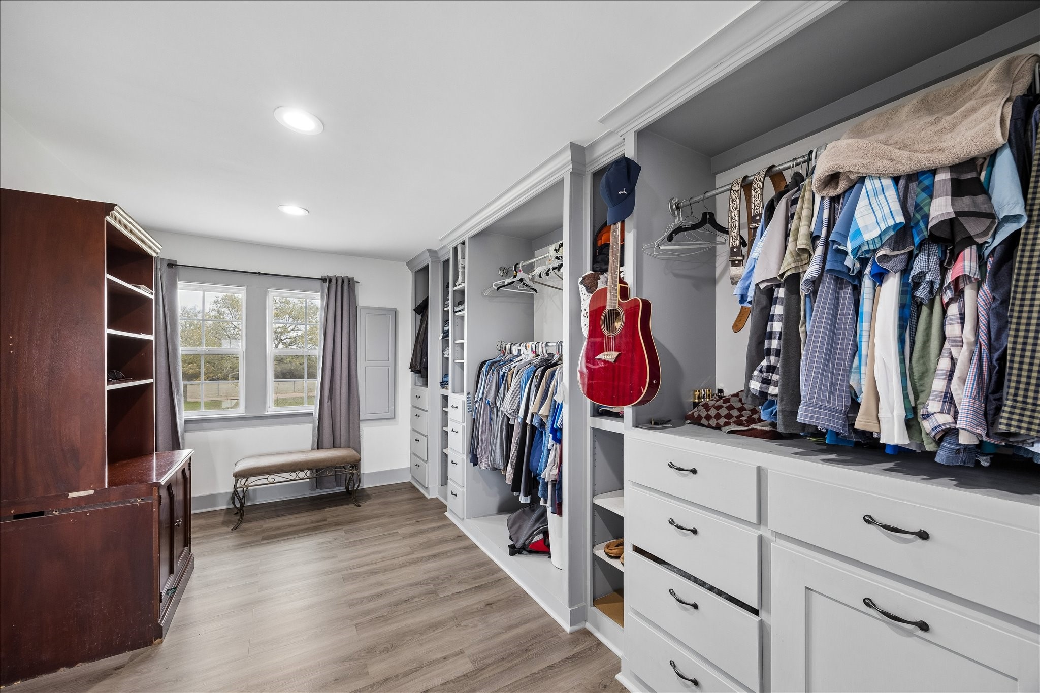 4435 Hartfield Road Round Top, TX 78954 - Photo 20 of 20 a view of walk in closet with clothes and shoes