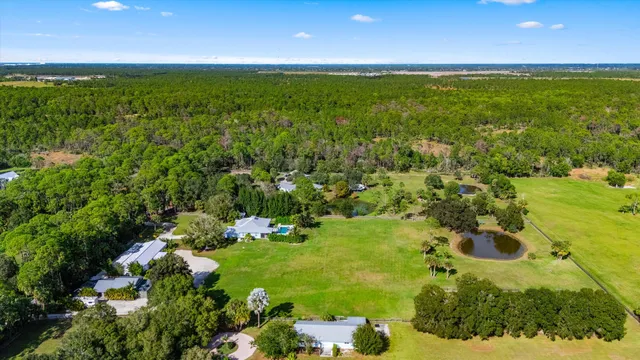 a view of a dining room with furniture and window