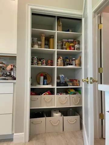 a view of a porch with furniture and a yard