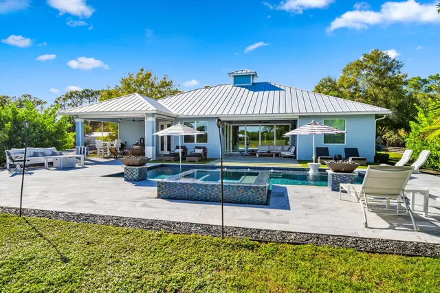 a view of a lush green outdoor space with a lake view