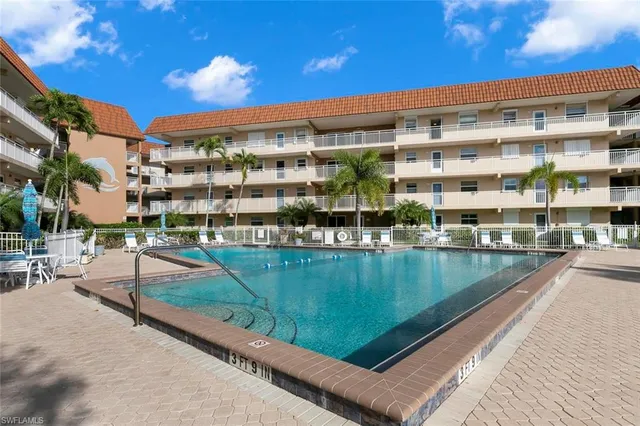 a view of a swimming pool with a patio