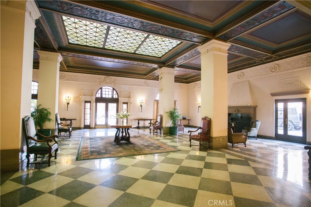 315 West 3rd Street, Unit 305 Long Beach, CA 90802 - Photo 12 of 19 a living room with lots of tables and chairs