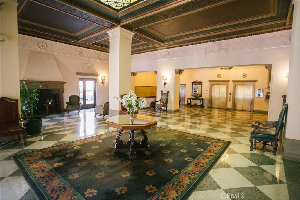 315 West 3rd Street, Unit 305 Long Beach, CA 90802 - Photo 13 of 19 a living room with fireplace furniture and a potted plant