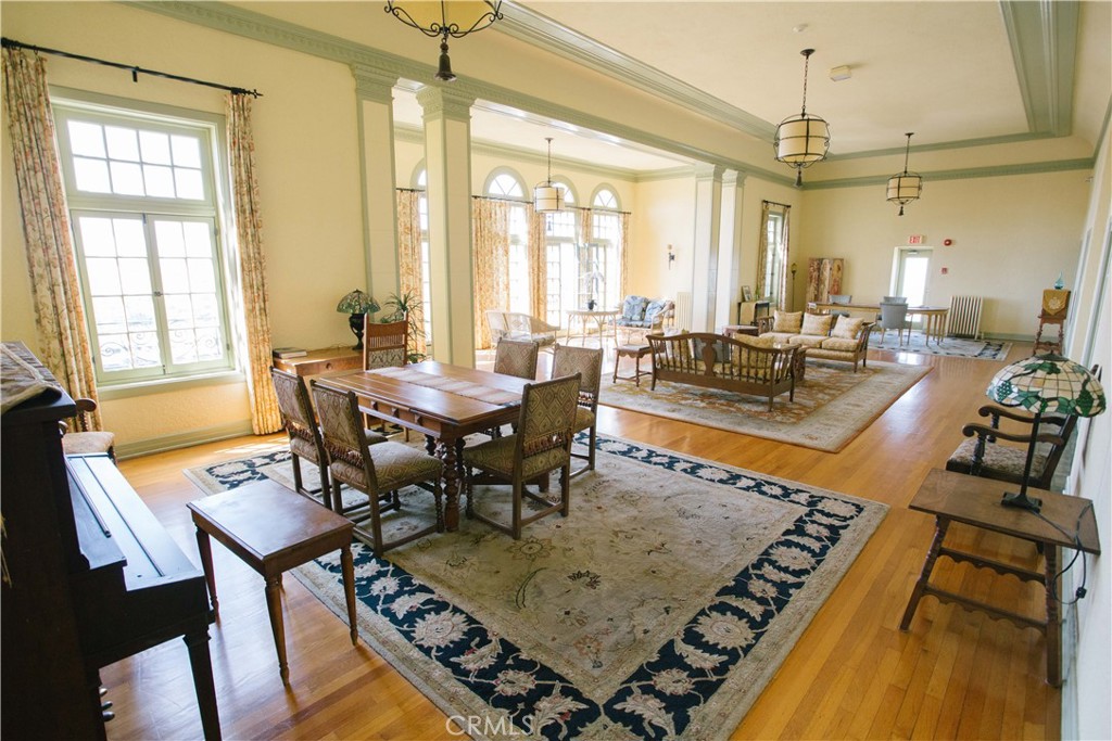 315 West 3rd Street, Unit 305 Long Beach, CA 90802 - Photo 16 of 19 a view of a dining room and livingroom with furniture wooden floor a chandelier