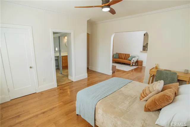 a bedroom with a bed and a couch