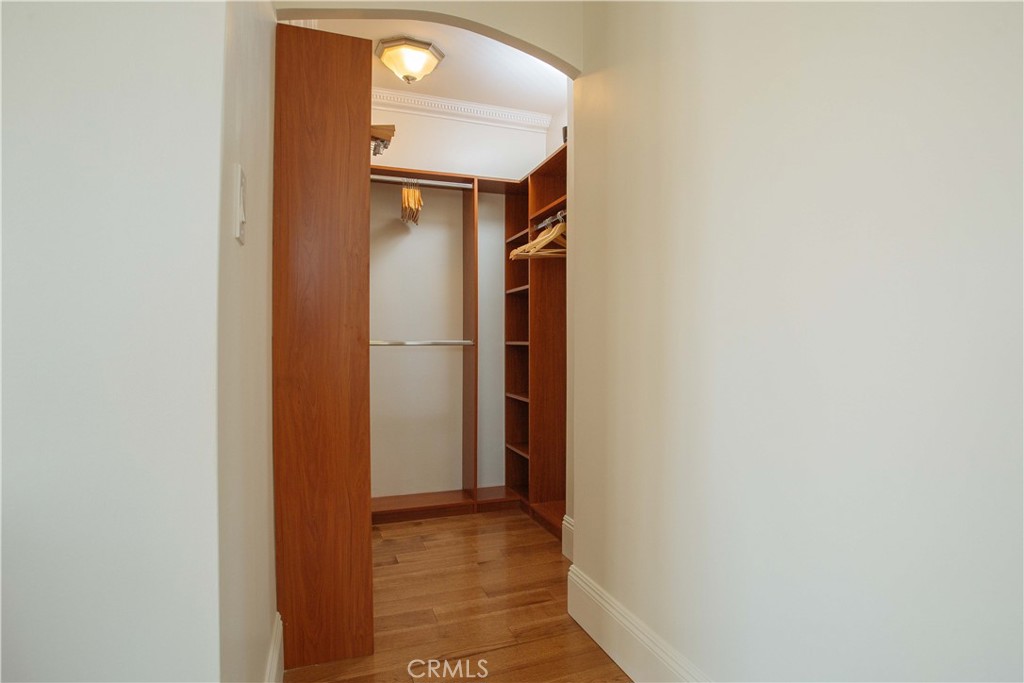315 West 3rd Street, Unit 305 Long Beach, CA 90802 - Photo 8 of 19 a view of a hallway with wooden floor and a bathroom