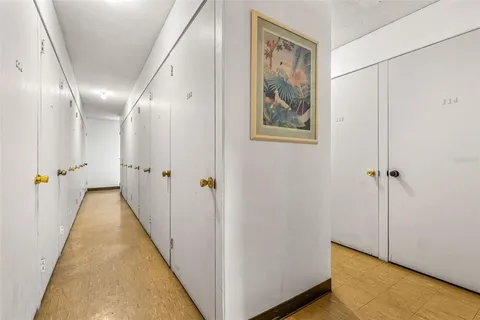 a view of a hallway with paintings on the wall
