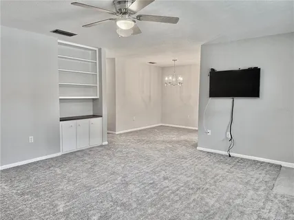 a view of an empty room with a flat screen tv