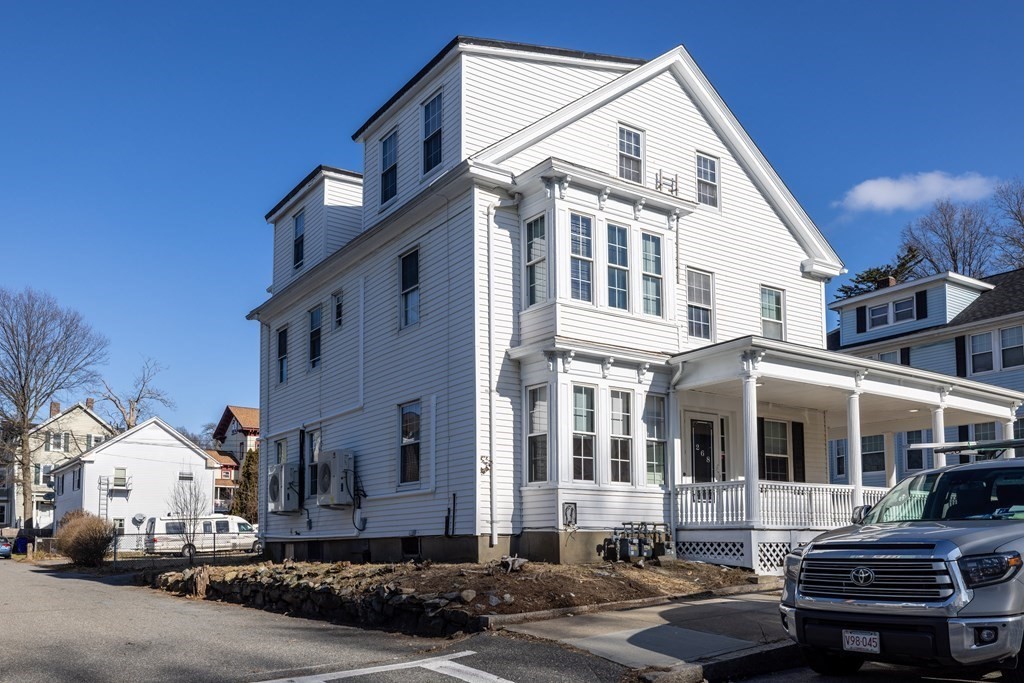 268 Locust Street Fall River, MA 02720 - Photo 1 of 38 a front view of a residential apartment building with cars parked
