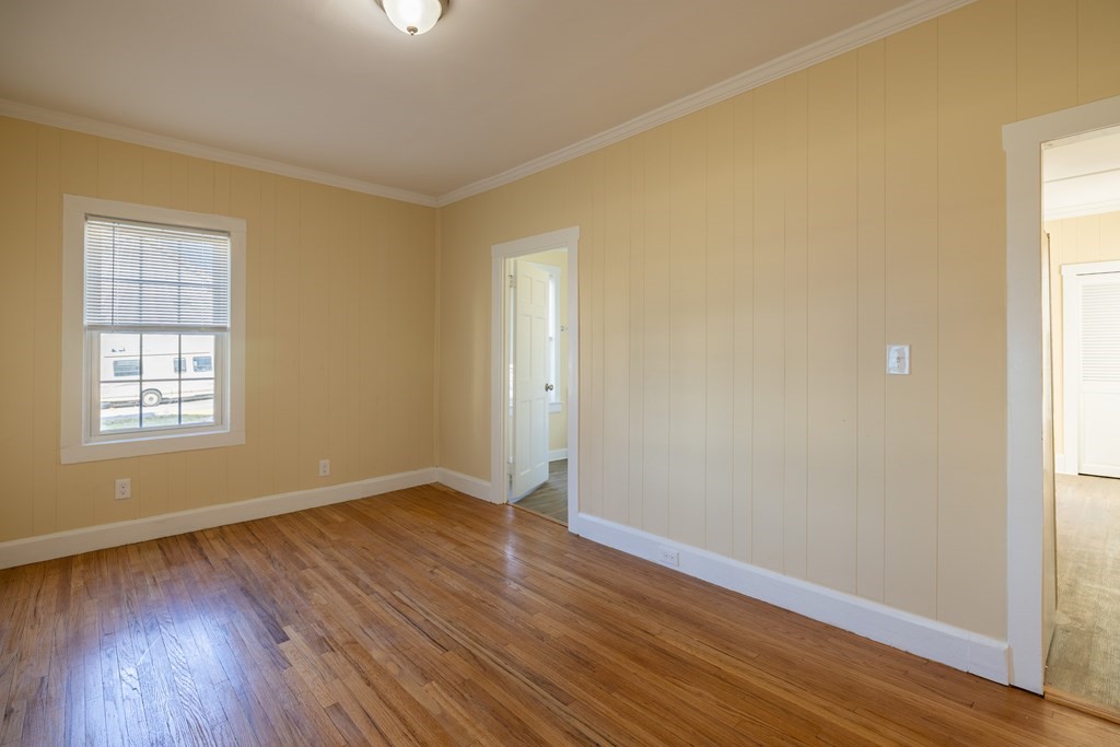 268 Locust Street Fall River, MA 02720 - Photo 13 of 38 a view of an empty room with wooden floor and a window