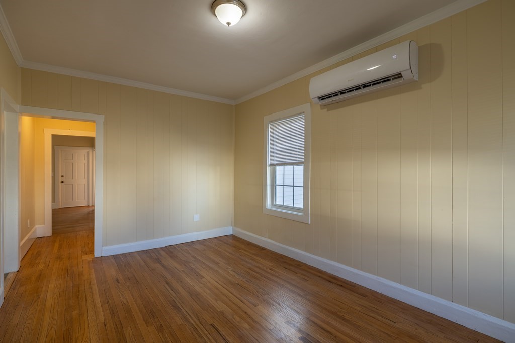 268 Locust Street Fall River, MA 02720 - Photo 14 of 38 a view of an empty room with wooden floor and a window