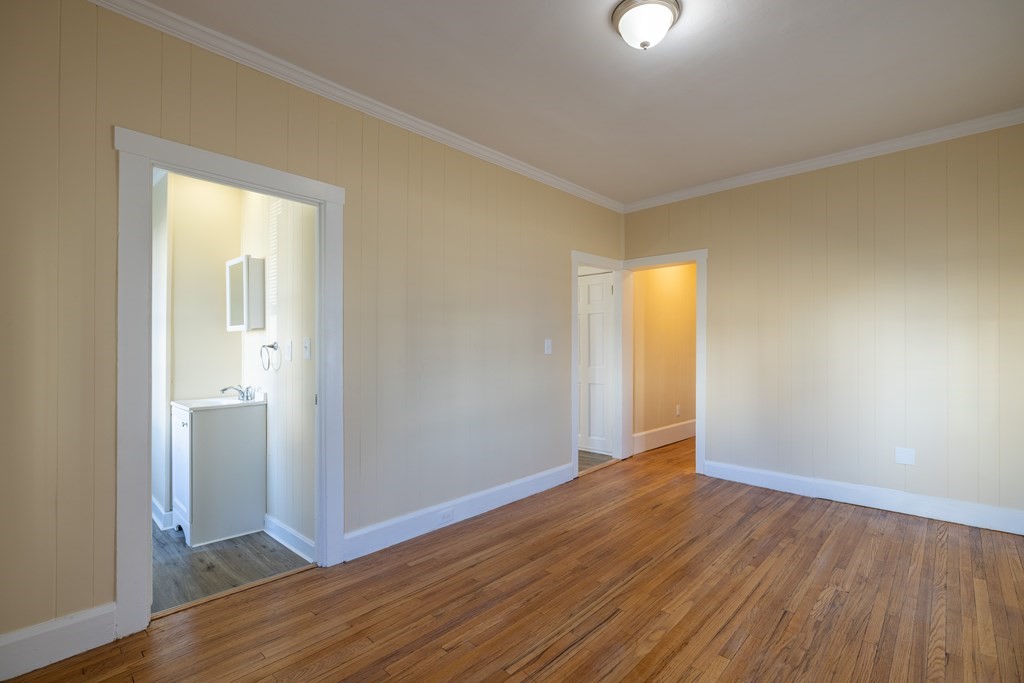 268 Locust Street Fall River, MA 02720 - Photo 15 of 38 an empty room with wooden floor and windows