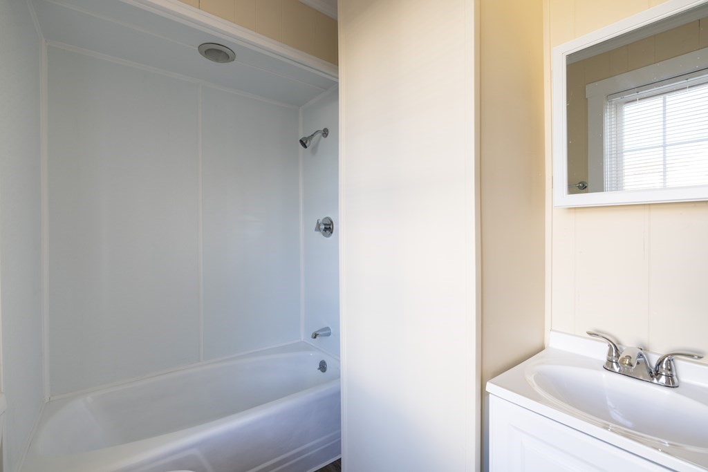 268 Locust Street Fall River, MA 02720 - Photo 16 of 38 a bathroom with a bathtub and a sink