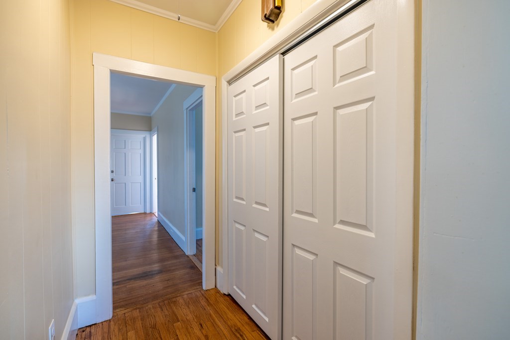 268 Locust Street Fall River, MA 02720 - Photo 17 of 38 a view of a hallway with wooden floor