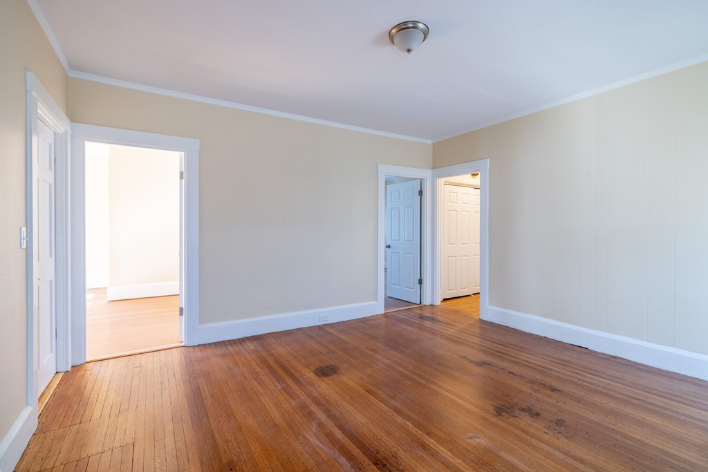 268 Locust Street Fall River, MA 02720 - Photo 18 of 38 a view of an empty room with wooden floor