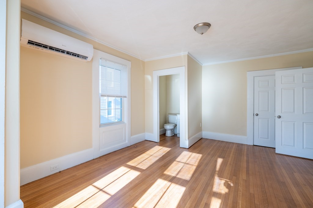 268 Locust Street Fall River, MA 02720 - Photo 20 of 38 a view of a room with wooden floor and bathroom