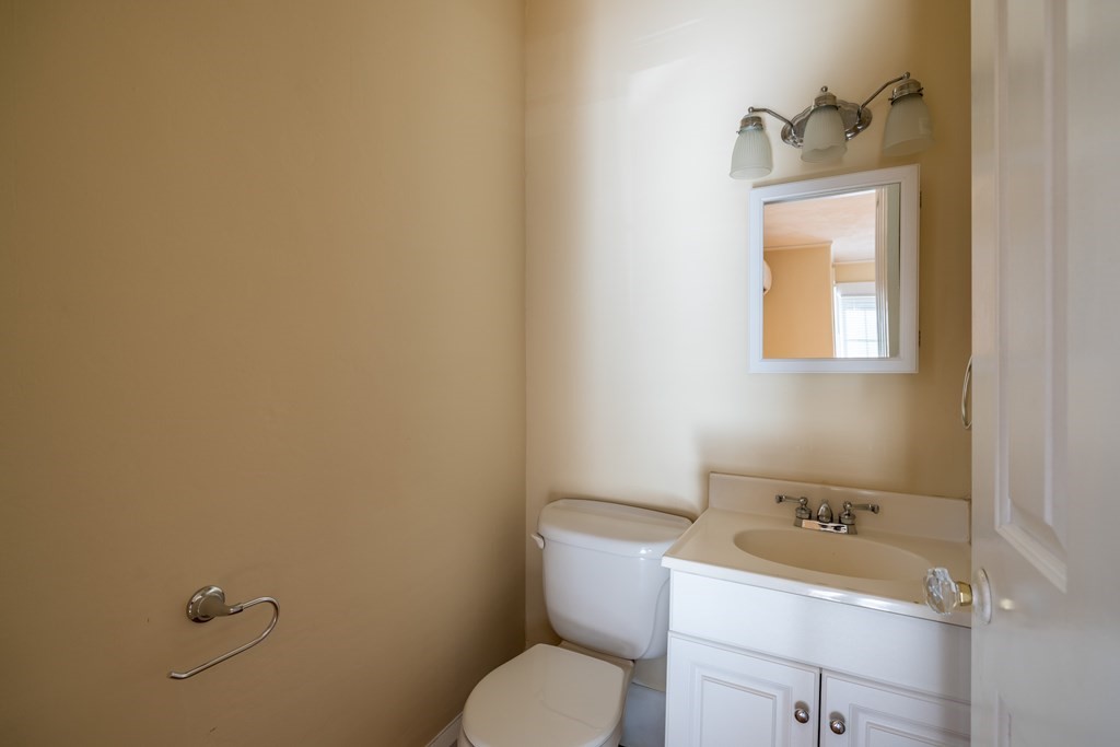 268 Locust Street Fall River, MA 02720 - Photo 21 of 38 a bathroom with a toilet sink and mirror