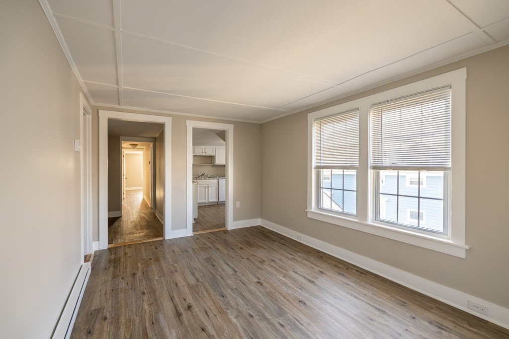 268 Locust Street Fall River, MA 02720 - Photo 31 of 38 an empty room with wooden floor and windows