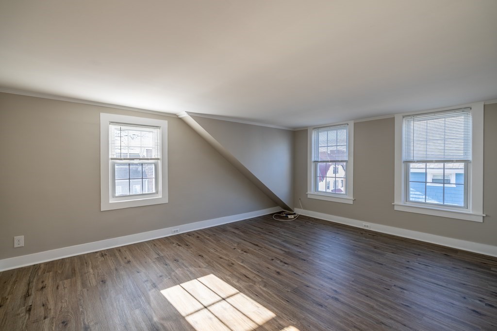268 Locust Street Fall River, MA 02720 - Photo 33 of 38 a view of an empty room with wooden floor and a window