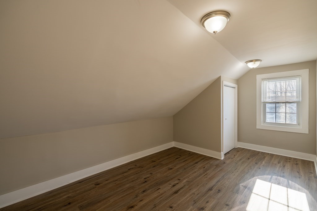 268 Locust Street Fall River, MA 02720 - Photo 36 of 38 an empty room with wooden floor and windows