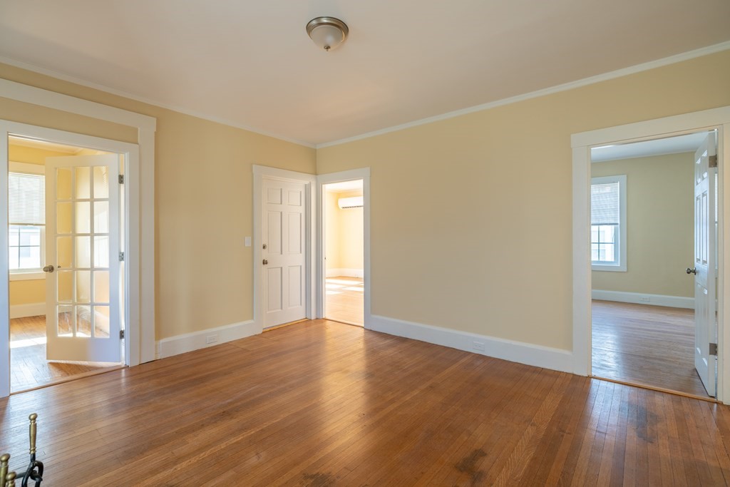 268 Locust Street Fall River, MA 02720 - Photo 10 of 38 a view of an empty room with wooden floor