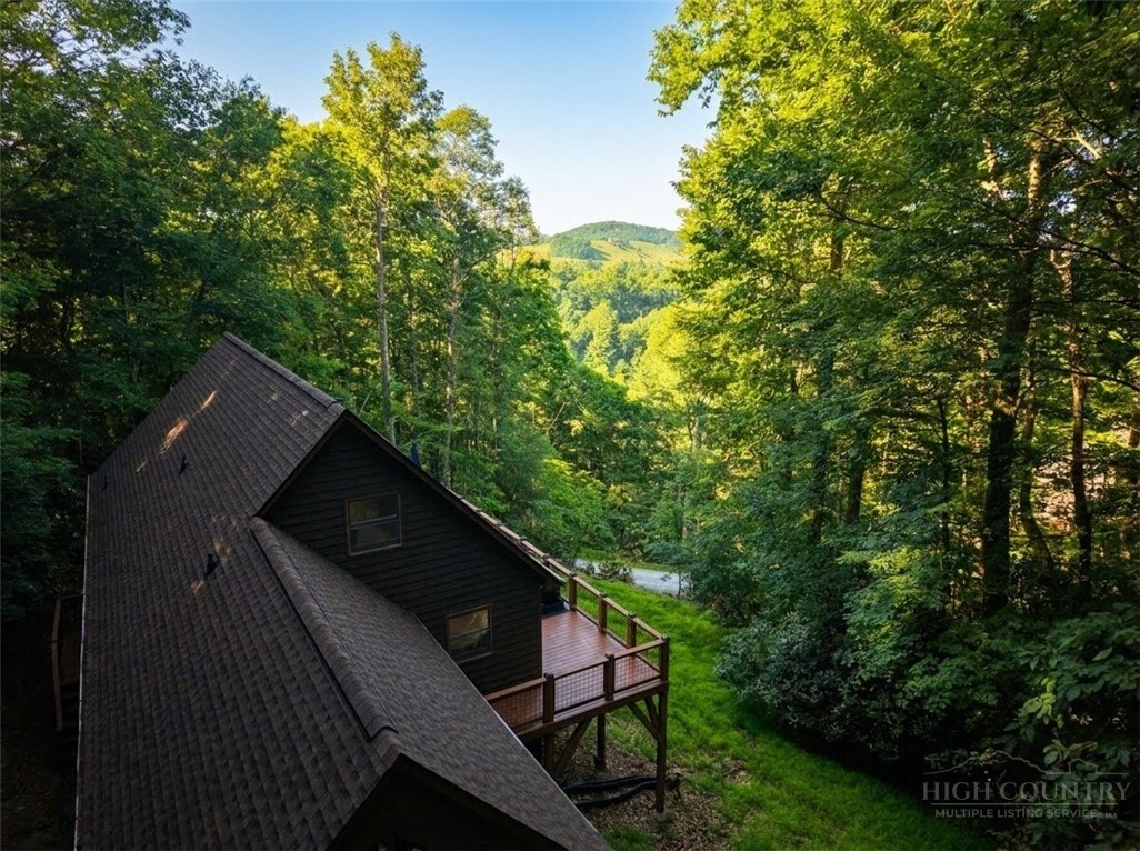 159 Easy Street Boone, NC 28607 - Photo 40 of 46 a backyard of a house with lots of green space