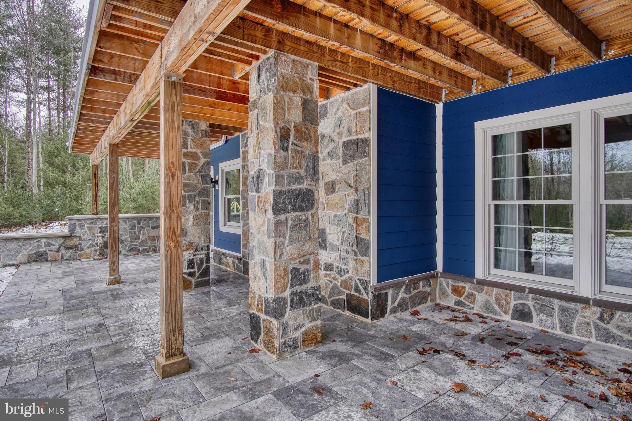 401 Orchard Road Orrtanna, PA 17353 - Photo 8 of 54 Walkout basement stone patio partially covered