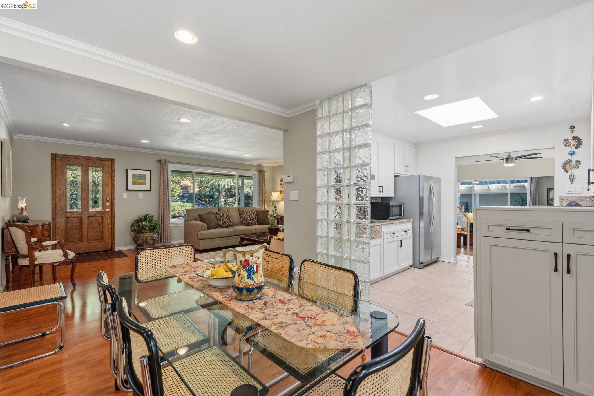 5075 Alhambra Valley Road Martinez, CA 94553 - Photo 11 of 68 Hardwood flooring, recessed lighting, glass block partition, kitchen with white cabinetry, and a skylight