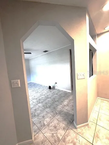 a view of an empty room and window