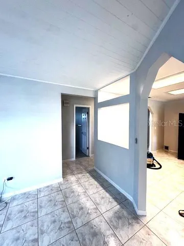 a utility room with mirror washer and dryer