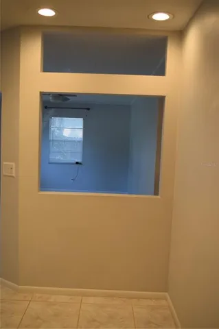 a view of an empty room with a window