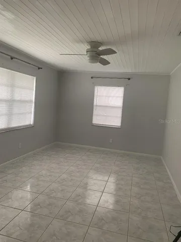 a view of an empty room and a window