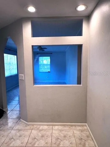 a kitchen with a refrigerator and a sink