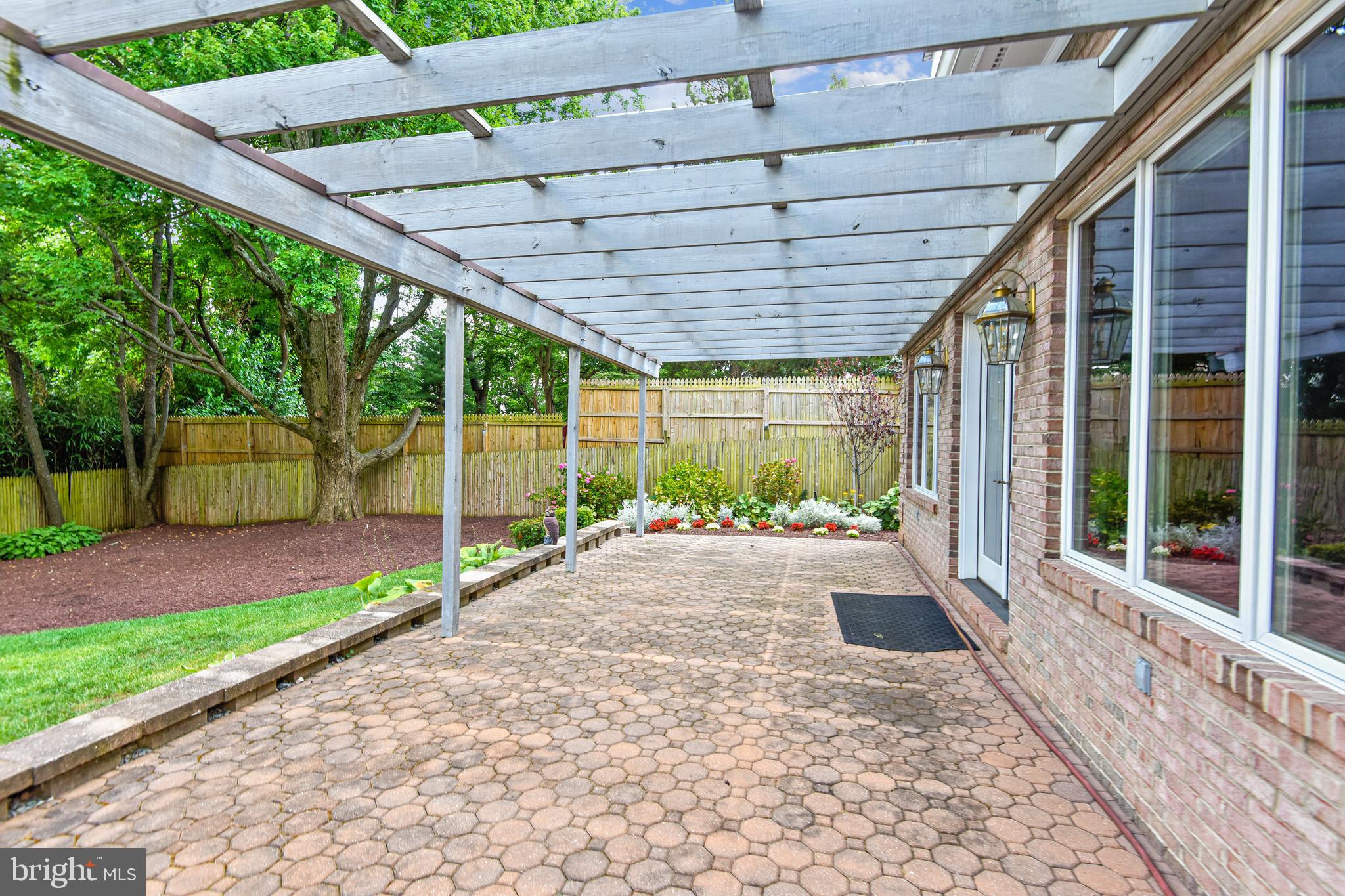 11911 Seven Locks Road Potomac, MD 20854 - Photo 52 of 57 Large patio with pergola off living room