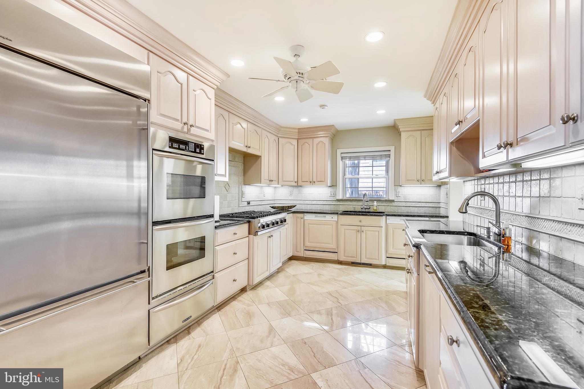 11911 Seven Locks Road Potomac, MD 20854 - Photo 9 of 57 Renovated kitchen with stainless steel appliances