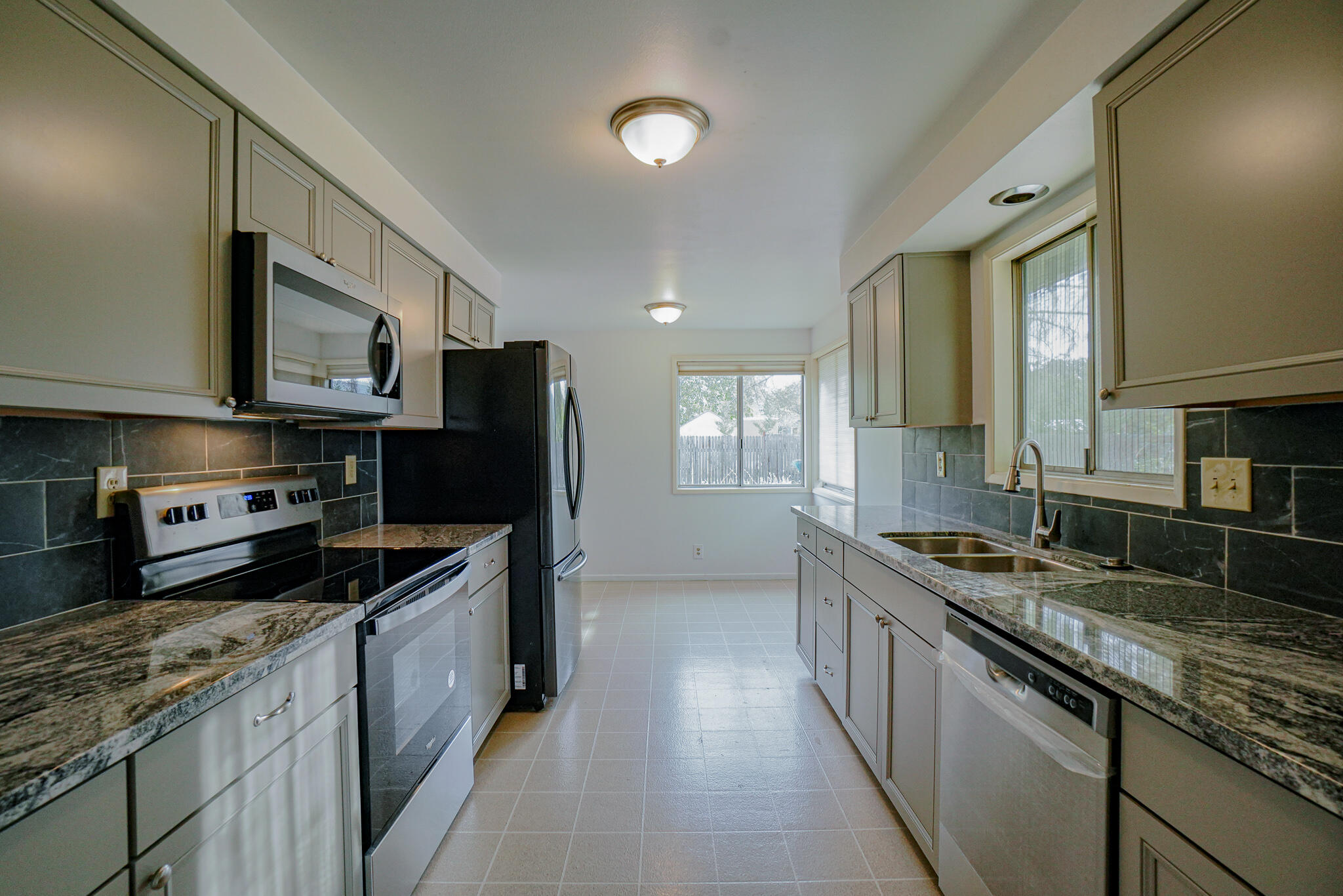 674 Oak Grove Road Medford, OR 97501 - Photo 10 of 47 Brand new kitchen with new cabinets, granite countertops and stainless steel appliances.