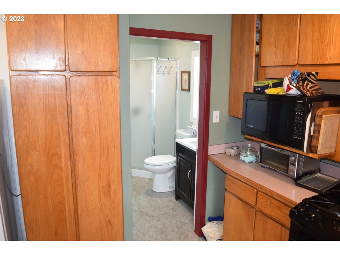 327 West Main Street Athena, OR 97813 - Photo 13 of 48 a bathroom with a sink a toilet and shower