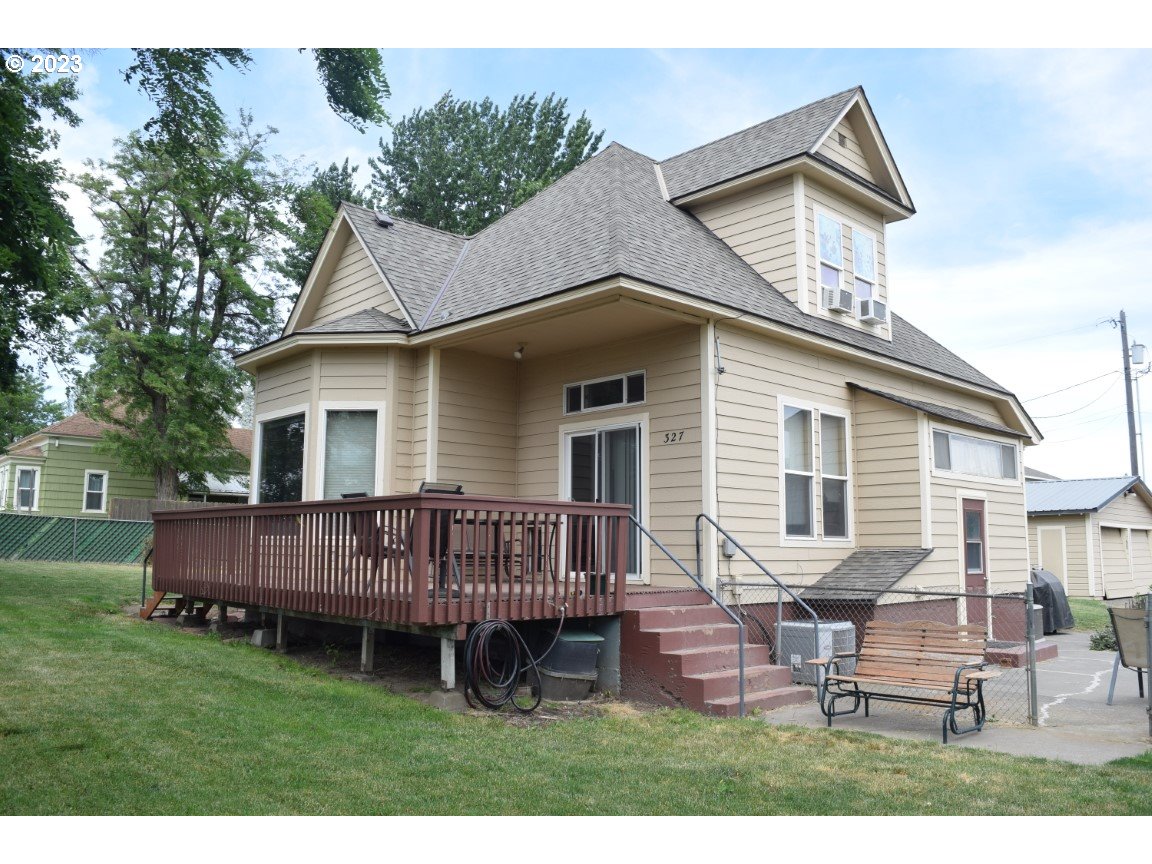 327 West Main Street Athena, OR 97813 - Photo 2 of 48 a view of a house with a yard and wooden deck