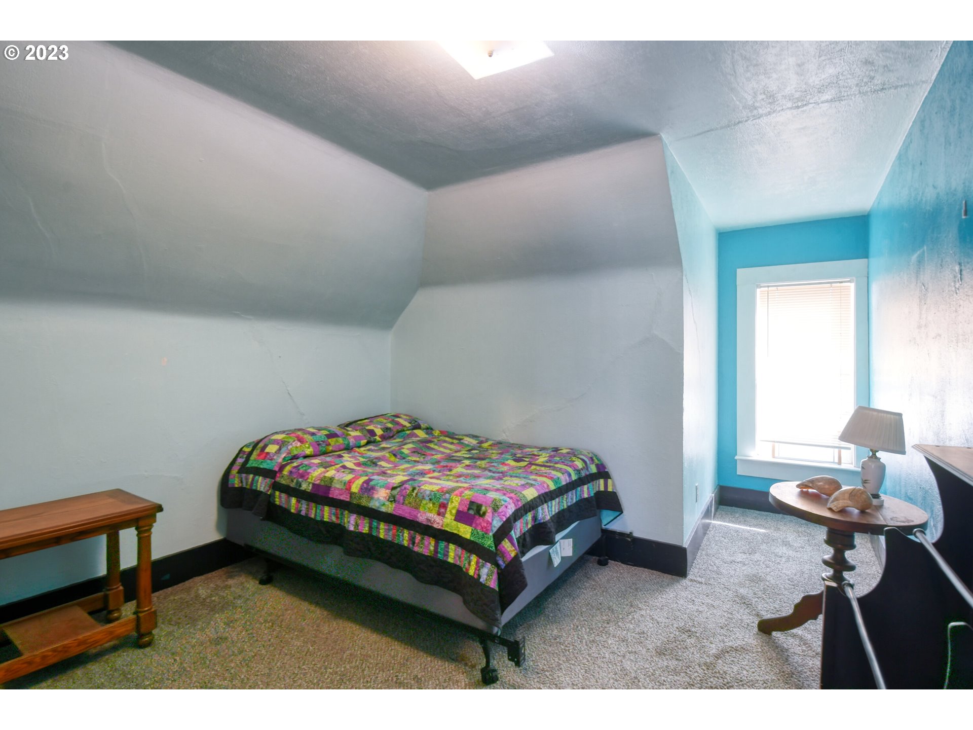 327 West Main Street Athena, OR 97813 - Photo 30 of 48 a bedroom with a bed a table and chair