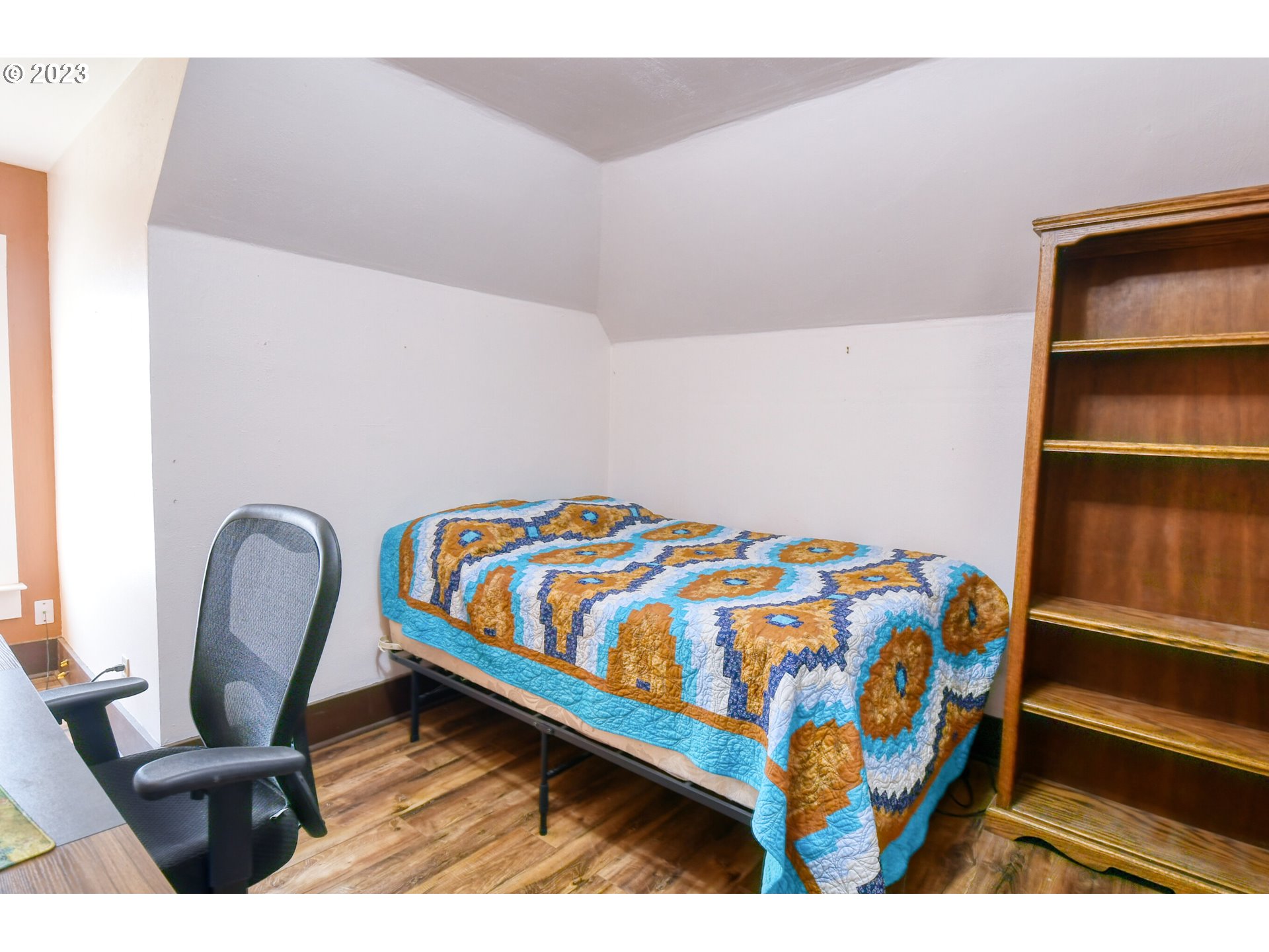 327 West Main Street Athena, OR 97813 - Photo 33 of 48 a bedroom with a bed and wooden floor
