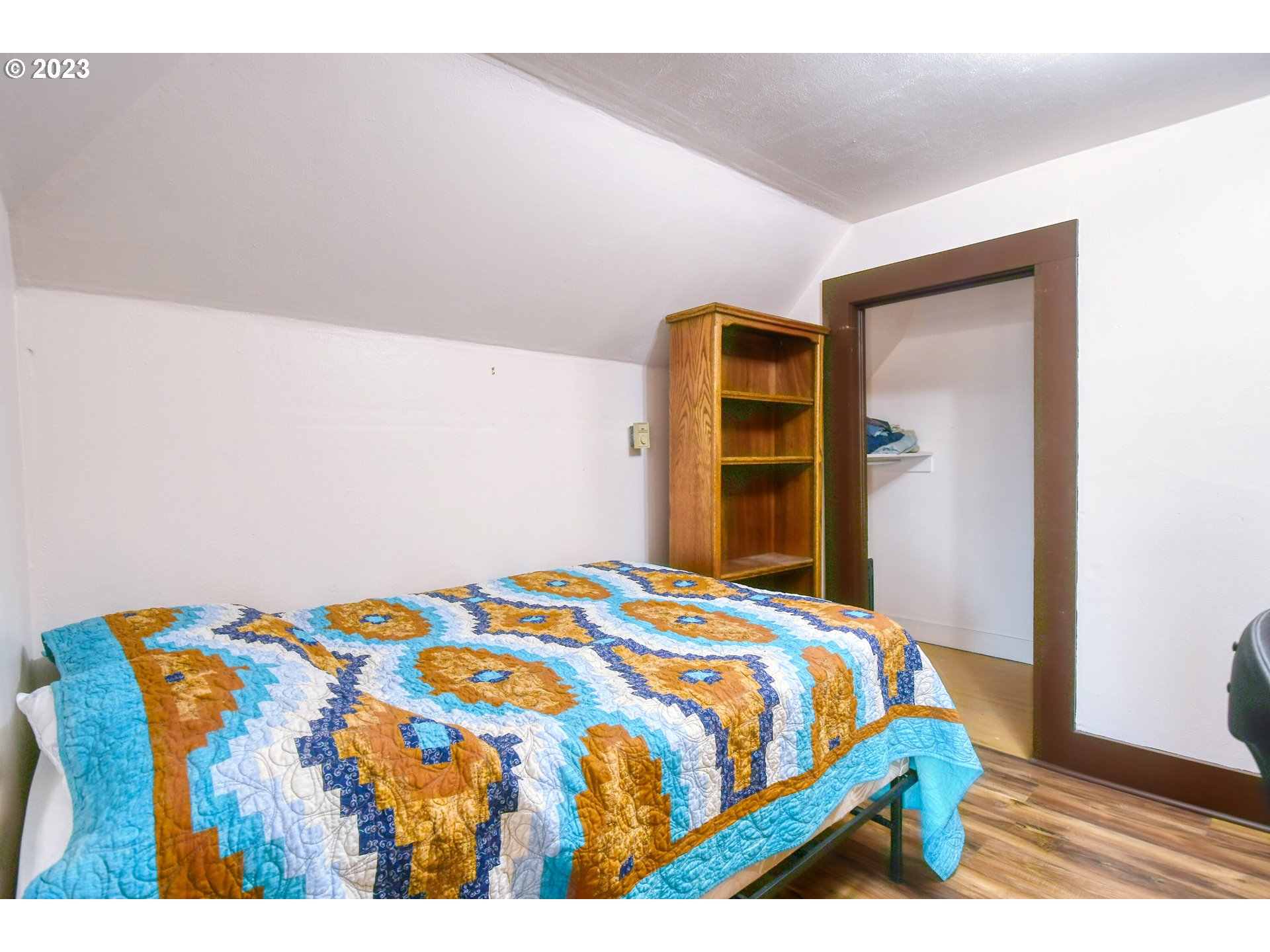 327 West Main Street Athena, OR 97813 - Photo 34 of 48 a bedroom with a bed and wooden floor